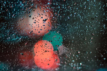 Droplets of water on the windows of a truck after going through a bespoke vehicle wash system