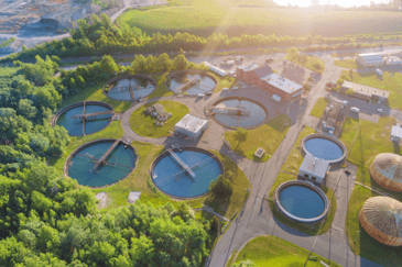 Aerial view of water treatment plants, highlighting the role of water management in preventing Legionella contamination.