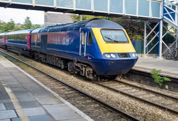 A train in the UK going to its next destination after getting cleaned using train wash systems for a more efficient clean.