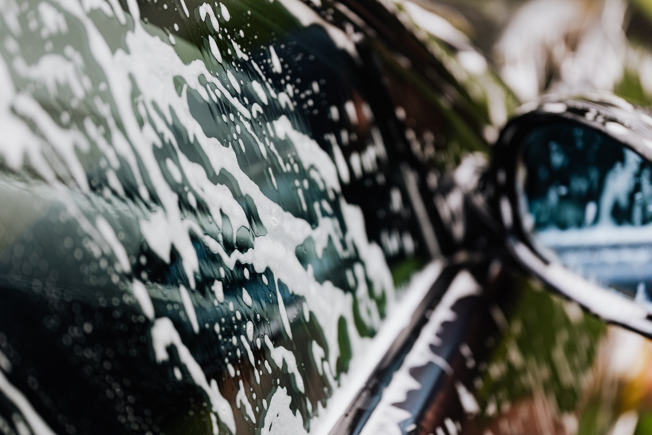  Close up on a vehicle window after going through a commercial wash system