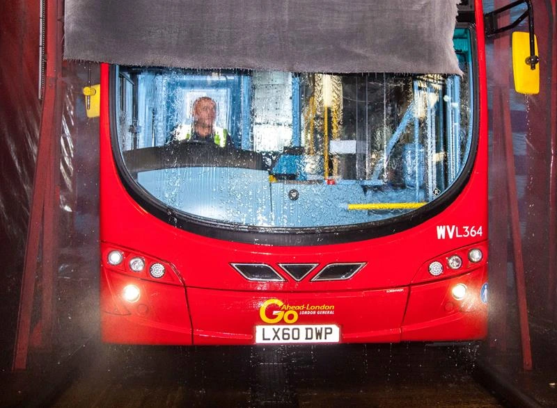 bus being washed in a bus wash system