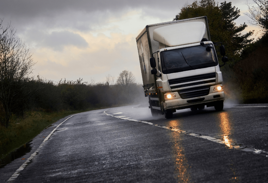  A cleaned truck on a road that has just been through a commercial vehicle wash system that uses a recycling and water reclamation system.