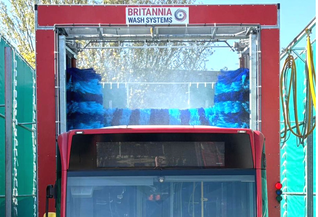 A Britannia Wash Systems 4 brush system washing a bus. 