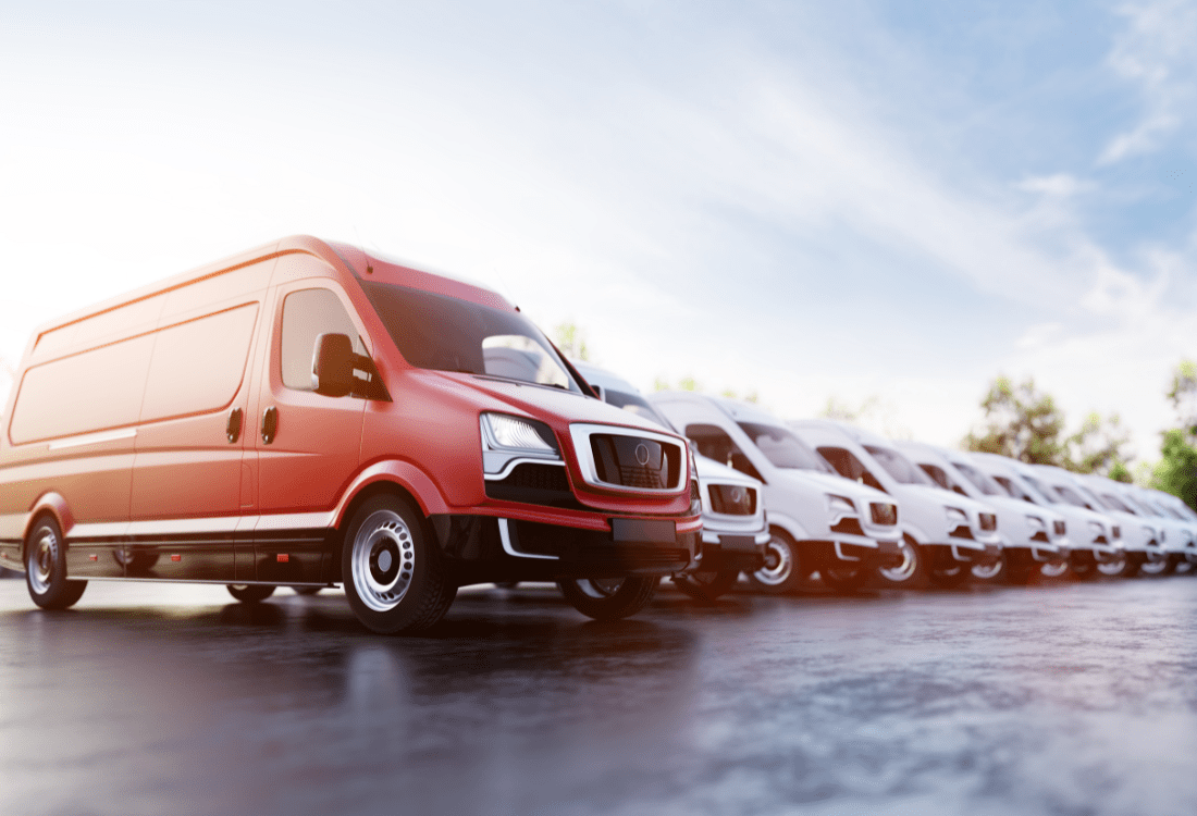  A fleet of red and white trucks that’s been cleaned with a tailored truck washing system for optimal cleaning performance.