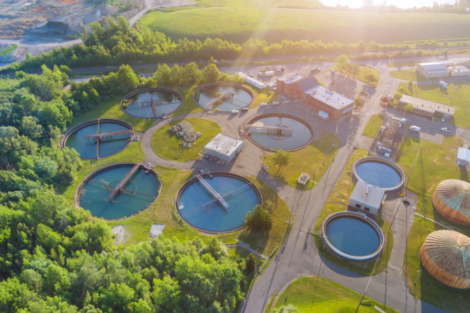 Aerial view of water treatment plants, highlighting the role of water management in preventing Legionella contamination.