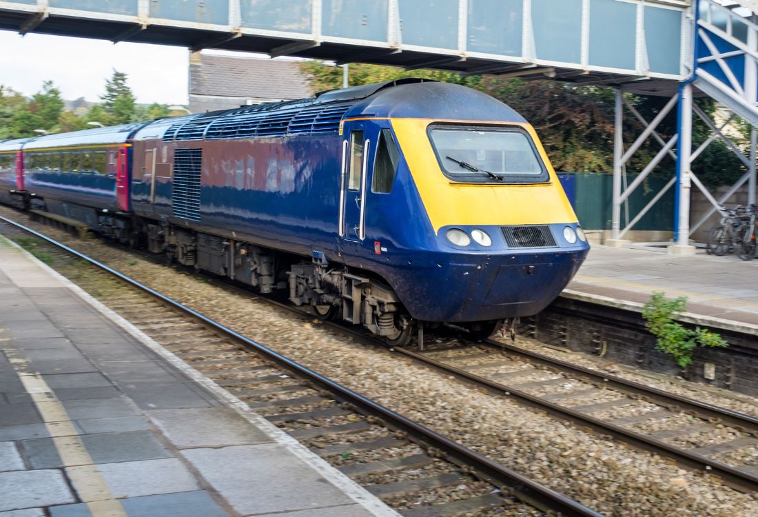 A train in the UK going to its next destination after getting cleaned using train wash systems for a more efficient clean.